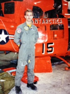 Mike Routen standing in front of Helicopter in Antarctica